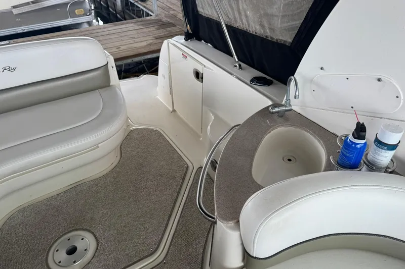 Slide: The Image of 2007 Sea Ray 260 Sundancer interior with seating, sink, and countertop. - 11