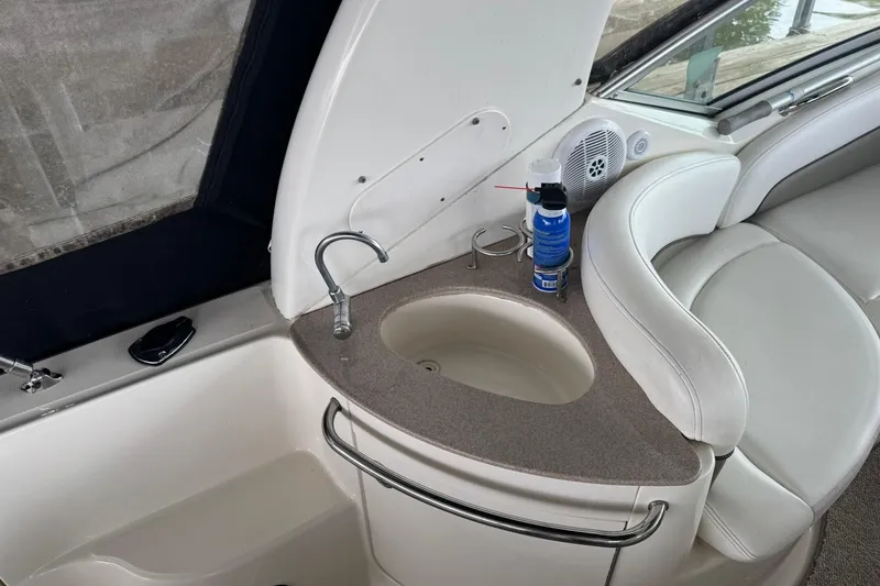 Slide: The Image of 2007 Sea Ray 260 Sundancer interior with sink, seating, and speaker. - 13