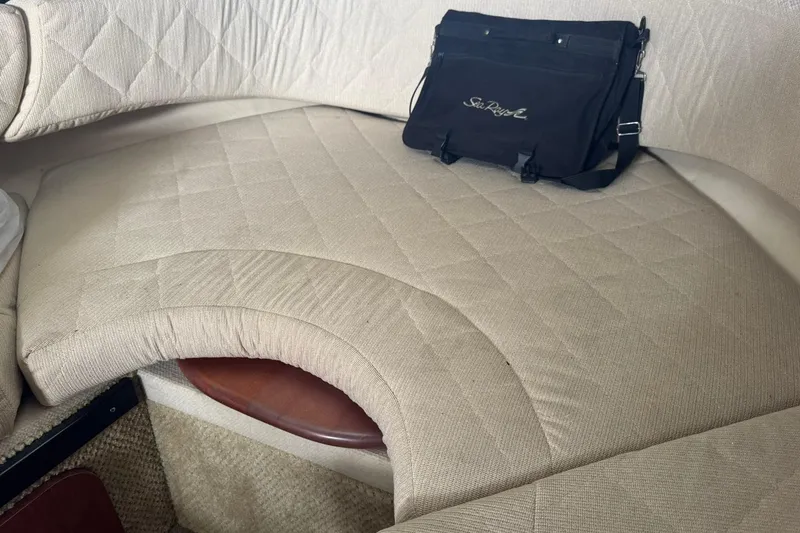 Slide: The Image of Interior of 2007 Sea Ray 260 Sundancer with beige upholstery and a black Sea Ray bag. - 19