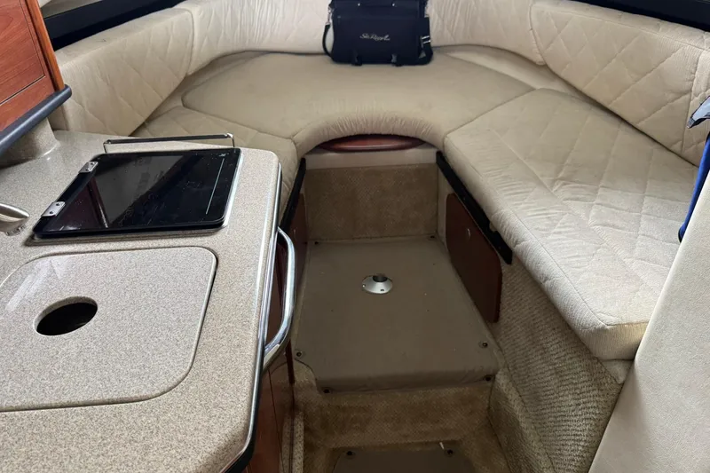Slide: The Image of Interior of a 2007 Sea Ray 260 Sundancer boat with beige seating and countertop. - 20