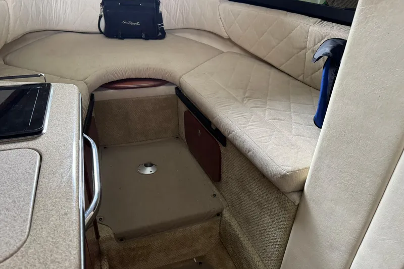 Slide: The Image of Interior cabin of 2007 Sea Ray 260 Sundancer with beige seating and table. - 21