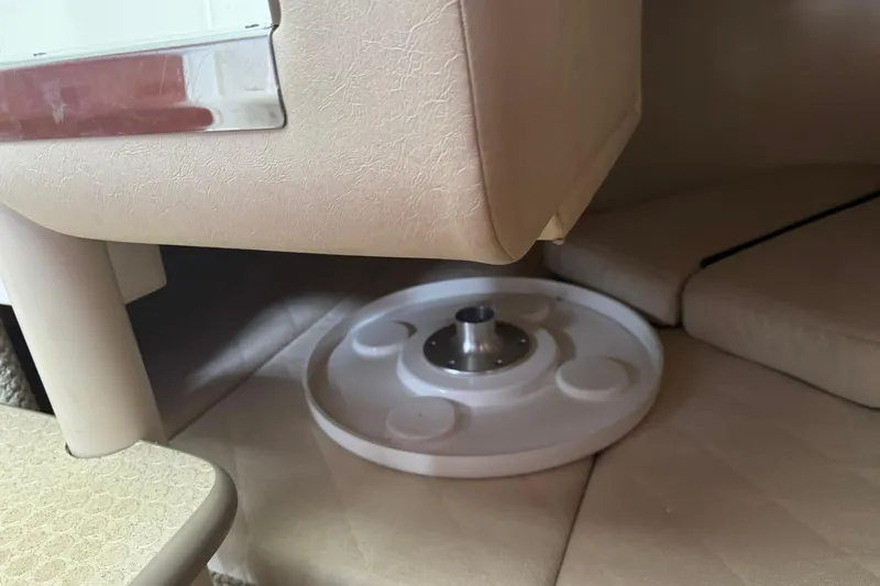 Slide: The Image of Interior of a 2007 Sea Ray 260 Sundancer boat, featuring seating and table base. - 24