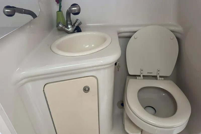 Slide: The Image of 2007 Sea Ray 260 Sundancer bathroom with sink and toilet. - 31