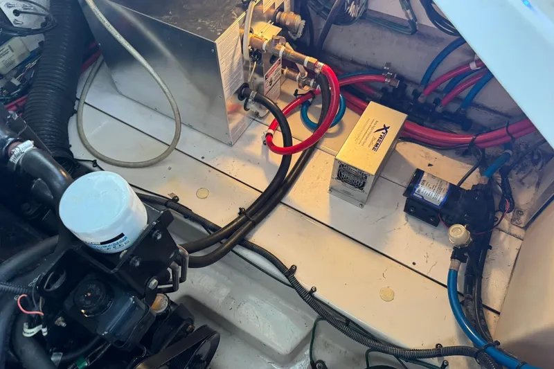 Slide: The Image of Engine compartment of a 2007 Sea Ray 260 Sundancer with wiring and components visible. - 35