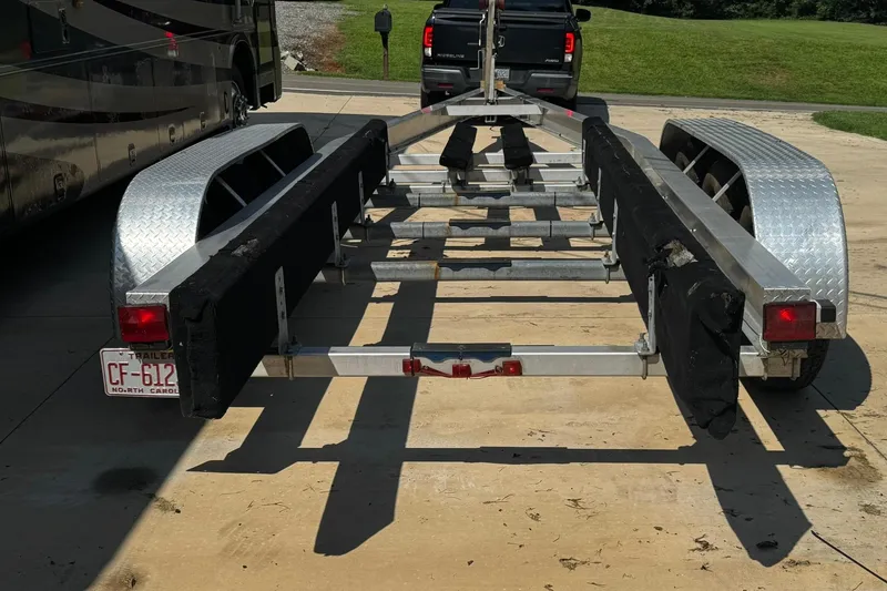 Slide: The Image of Boat trailer for 2007 Sea Ray 260 Sundancer, parked on a driveway. - 40