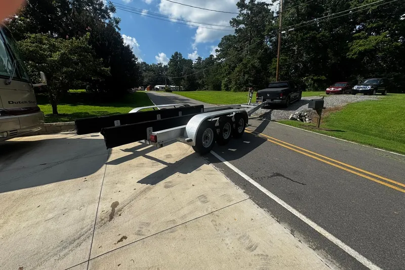 Slide: The Image of Trailer for 2007 Sea Ray 260 Sundancer on a sunny suburban road. - 41