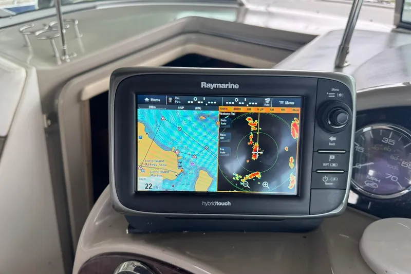 Slide: The Image of Raymarine navigation system on 2007 Sea Ray 260 Sundancer boat dashboard. - 9
