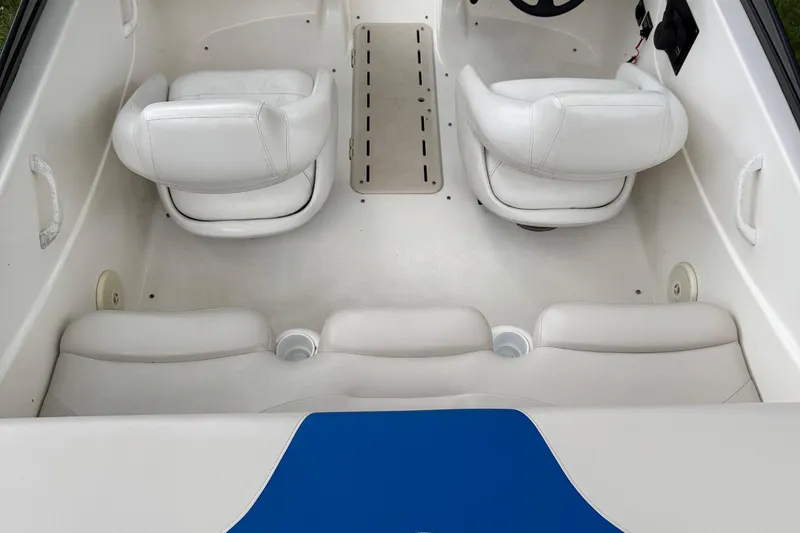 Slide: The Image of 2008 Glastron MX175 boat interior with white seating and blue accents. - 6