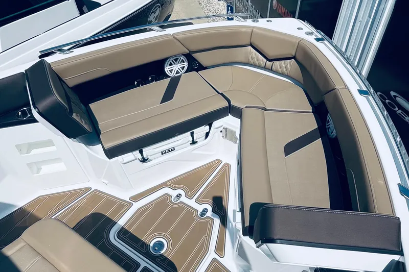 Slide: The Image of Luxurious seating area on 2026 Monterey Elite 30 OB boat with tan cushions and stylish flooring. - 12