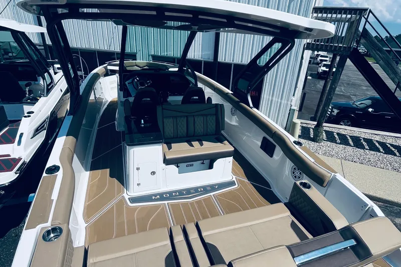 Slide: The Image of 2026 Monterey Elite 30 OB boat with spacious seating and modern design. - 3