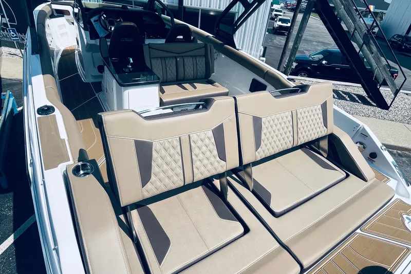 Slide: The Image of 2026 Monterey Elite 30 OB boat with luxurious tan seating and modern design. - 5