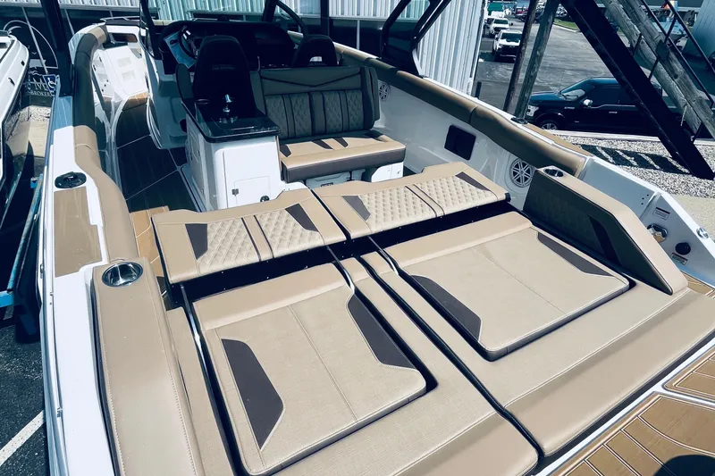 Slide: The Image of 2026 Monterey Elite 30 OB boat with luxurious seating and modern design. - 6
