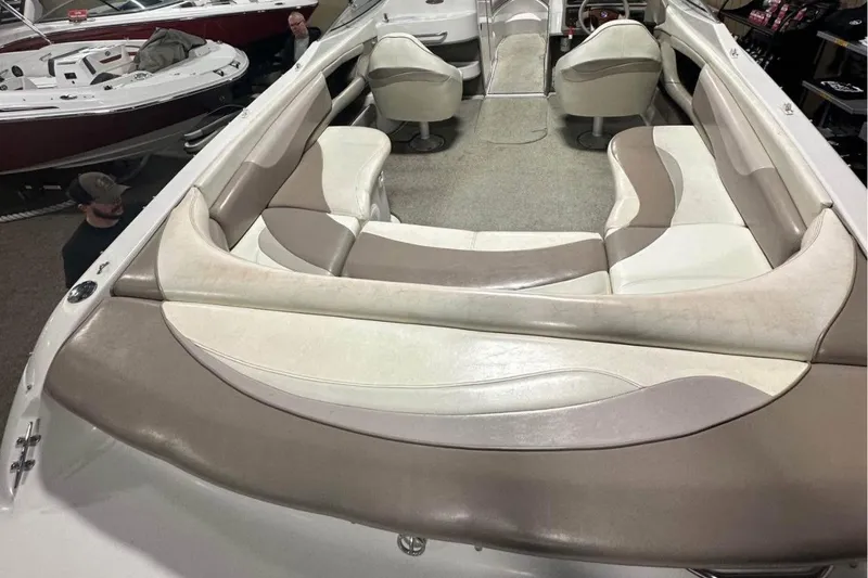 Slide: The Image of 1998 Four Winns 240 Horizon boat interior with beige and white seating. - 16