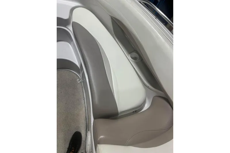 Slide: The Image of 1998 Four Winns 240 Horizon boat interior with beige and white seating. - 18