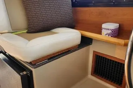 Slide: The Image of Interior seating area of a 2013 Cutwater C-26 boat with cushion and storage. - 7