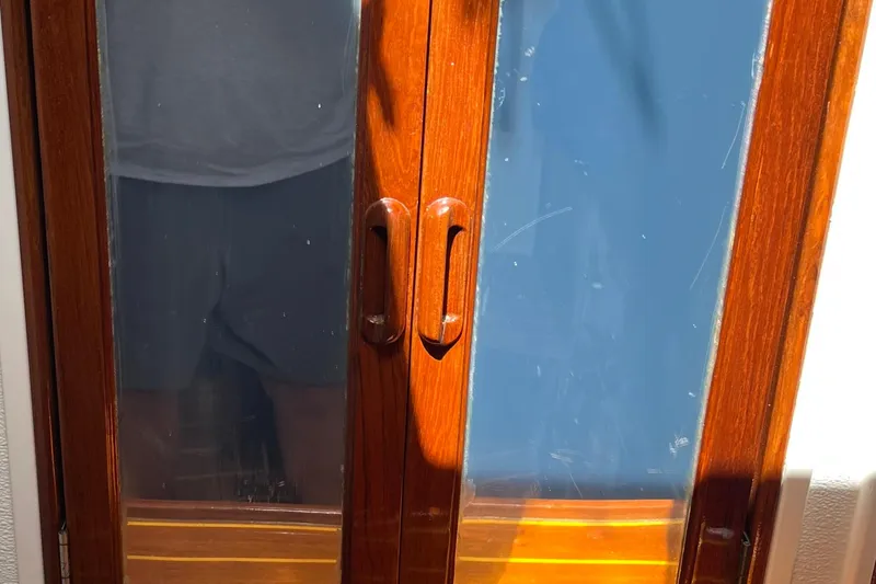 Slide: The Image of Wooden door with glass panels on a 1978 Morgan 415 boat. - 32