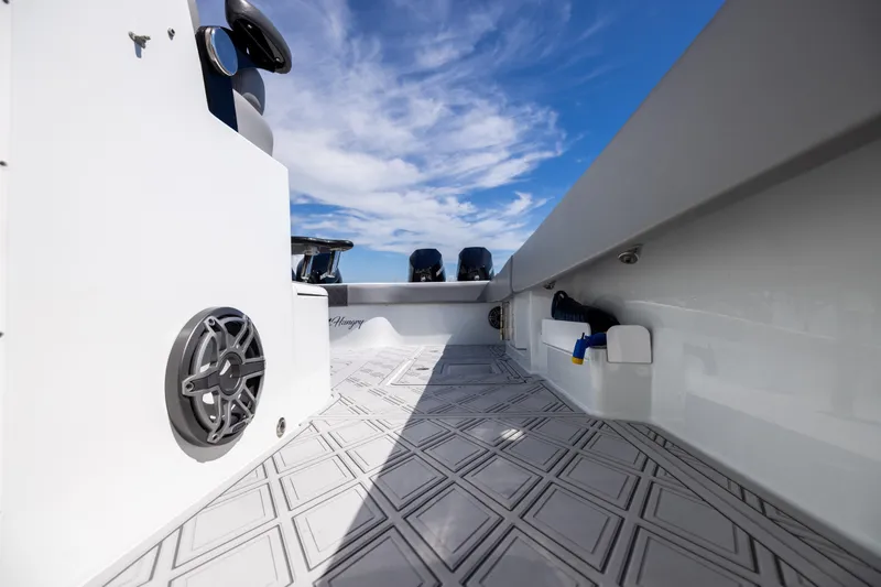 Slide: The Image of 2023 Freeman 47 boat interior with sleek design and modern features under a clear sky. - 100