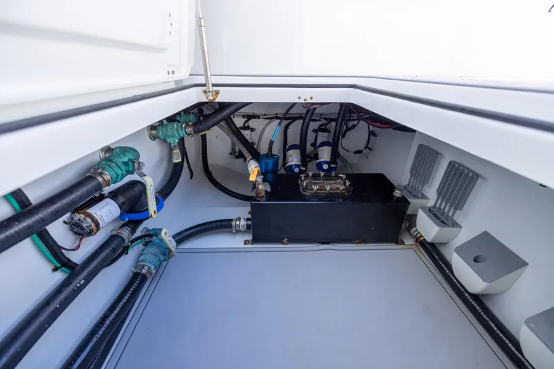 Slide: The Image of Freeman 47 boat interior, showcasing 2023 model's plumbing and wiring systems. - 112