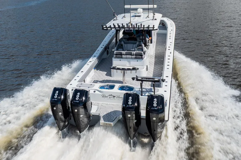 Slide: The Image of 2023 Freeman 47 boat with four powerful engines cruising on water. - 20