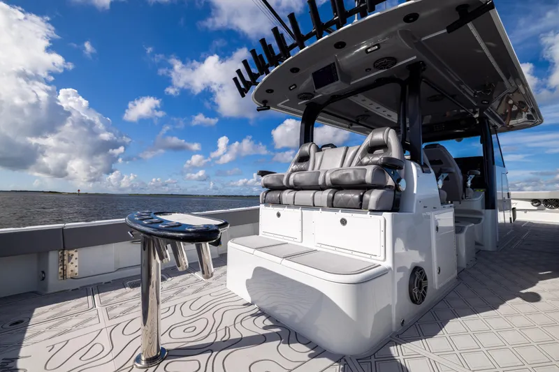Slide: The Image of 2023 Freeman 47 boat interior with seating, ocean view, and blue sky. - 44
