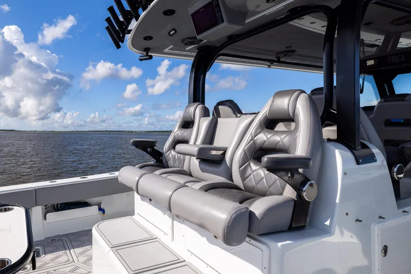 Slide: The Image of Luxurious seating on a 2023 Freeman 47 boat, with ocean view and blue sky. - 46