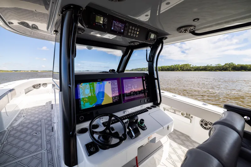 Slide: The Image of Interior view of 2023 Freeman 47 boat cockpit with advanced navigation system. - 66