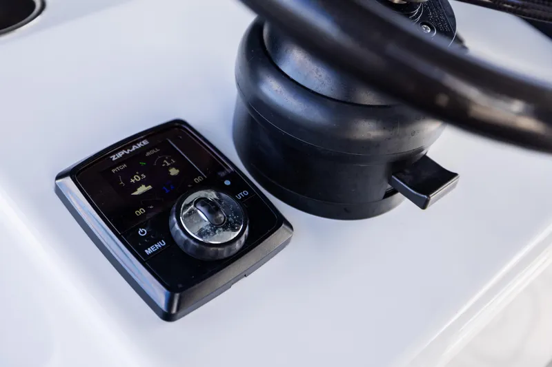 Slide: The Image of Control panel of a 2023 Freeman 47 boat with Zipwake system. - 73