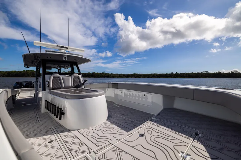 Slide: The Image of 2023 Freeman 47 boat on water, featuring spacious deck and modern design. - 91