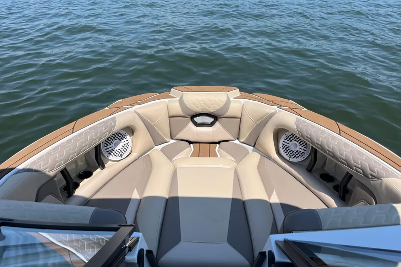 Slide: The Image of Luxurious interior of 2025 Centurion Ri230 boat with beige seating on water. - 5