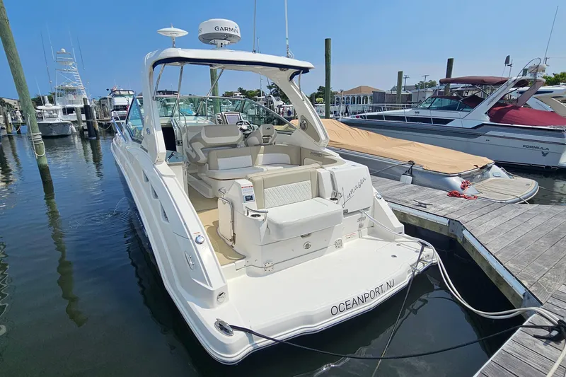 Slide: The Image of 2015 Chaparral 310 Signature boat docked at marina, Oceanport, NJ. - 10