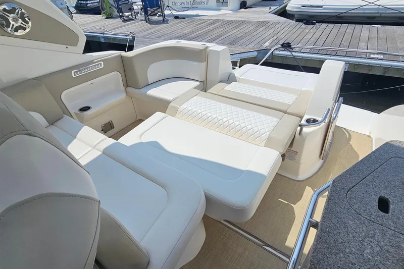 Slide: The Image of 2015 Chaparral 310 Signature boat interior with luxurious seating and elegant design. - 19