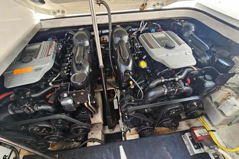 Slide: The Image of 2015 Chaparral 310 Signature engine compartment with dual inboard motors. - 36