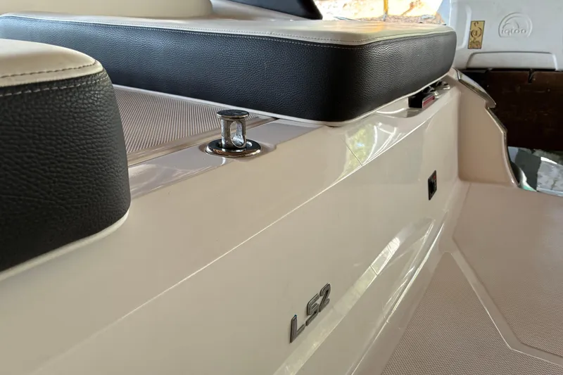 Slide: The Image of 2025 Regal LS2 boat interior with sleek seating and modern design elements. - 18