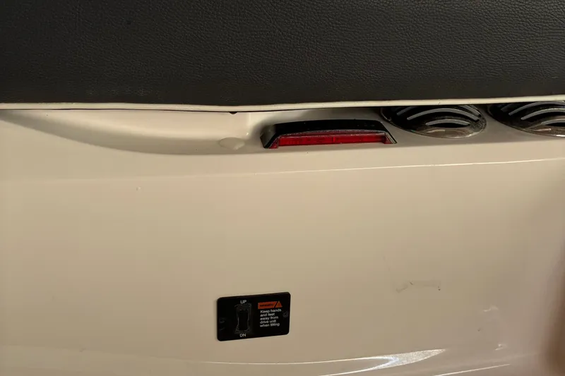Slide: The Image of 2025 Regal LS2 boat interior detail with control panel and ventilation. - 19