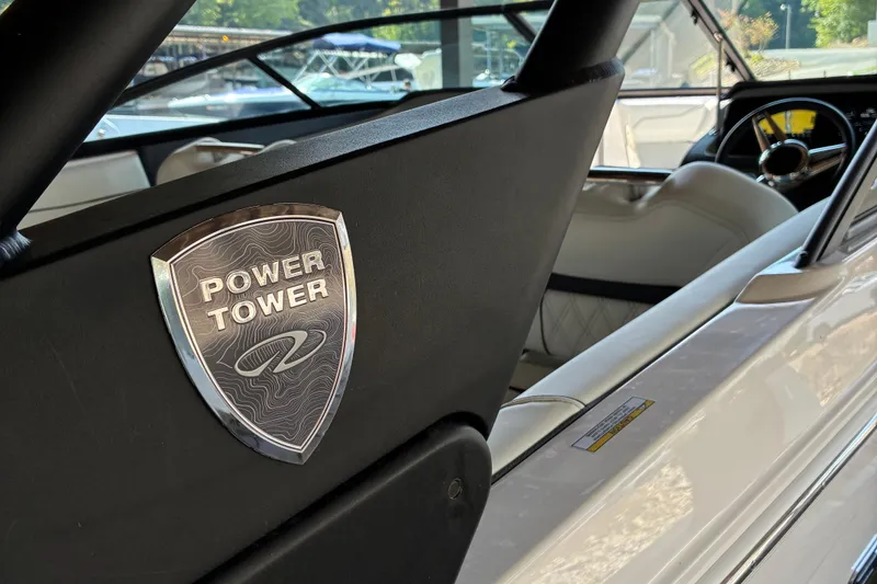 Slide: The Image of 2025 Regal LS2 boat interior with Power Tower emblem, showcasing luxury design. - 22