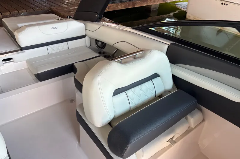 Slide: The Image of 2025 Regal LS2 boat interior with luxurious white and black seating. - 24