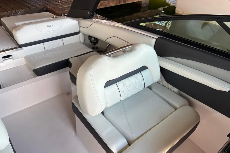 Slide: The Image of 2025 Regal LS2 boat interior with luxurious white seating and modern design. - 25