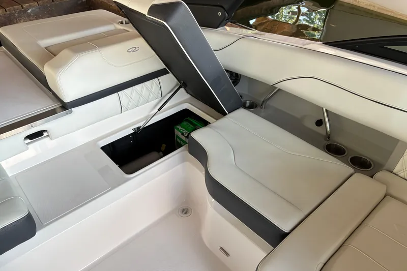 Slide: The Image of 2025 Regal LS2 boat interior with open storage compartment and sleek seating design. - 28