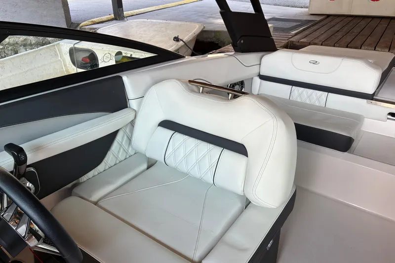 Slide: The Image of 2025 Regal LS2 boat interior with luxurious white leather seating and modern design. - 34