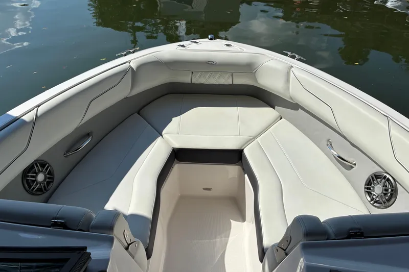 Slide: The Image of Luxurious interior of 2025 Regal LS2 boat with plush seating and speakers. - 38
