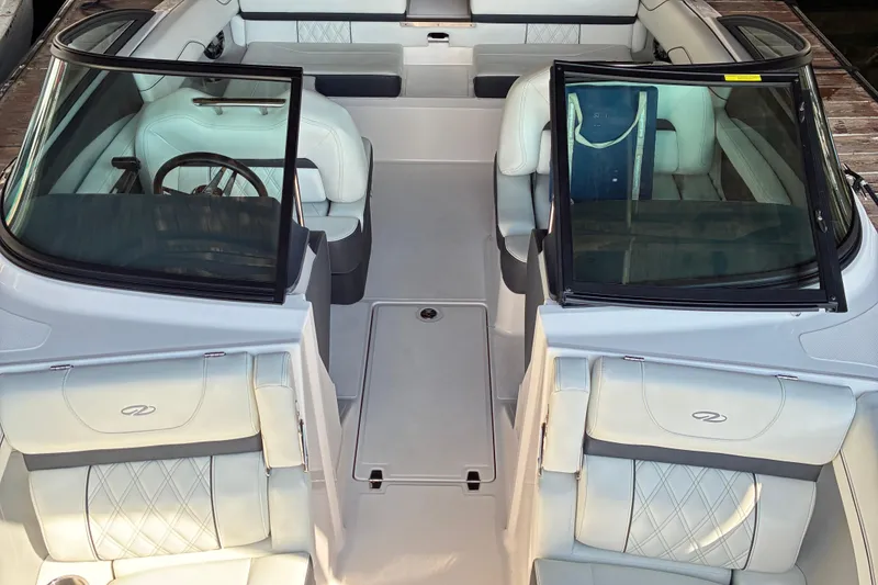 Slide: The Image of 2025 Regal LS2 boat interior with luxurious white seating and modern design. - 40