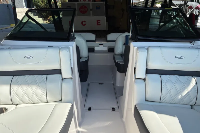Slide: The Image of 2025 Regal LS2 boat interior with white leather seating and modern design. - 42