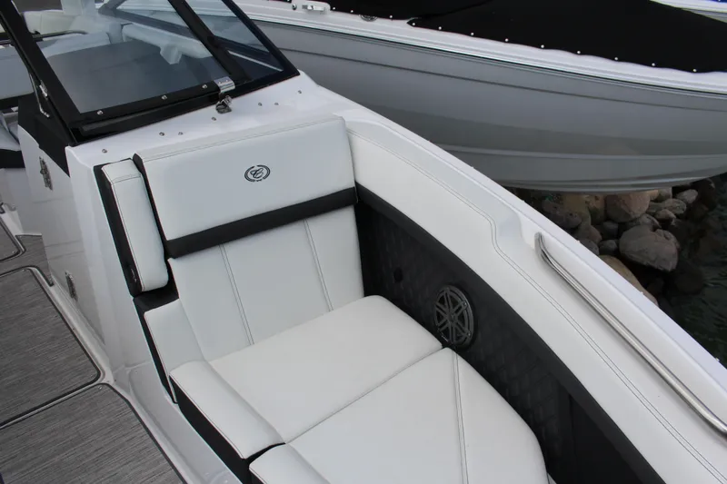 Slide: The Image of 2025 Cobalt R8 boat interior with white seating and sleek design. - 11