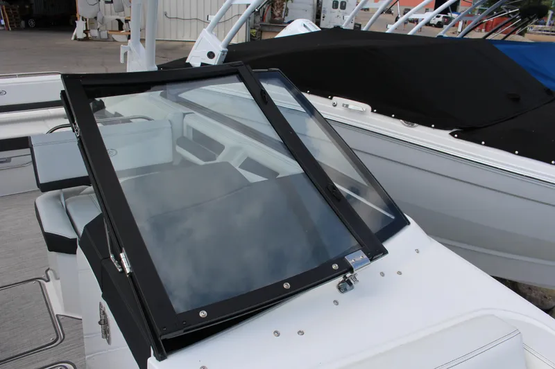 Slide: The Image of 2025 Cobalt R8 boat with sleek windshield and modern interior design. - 14