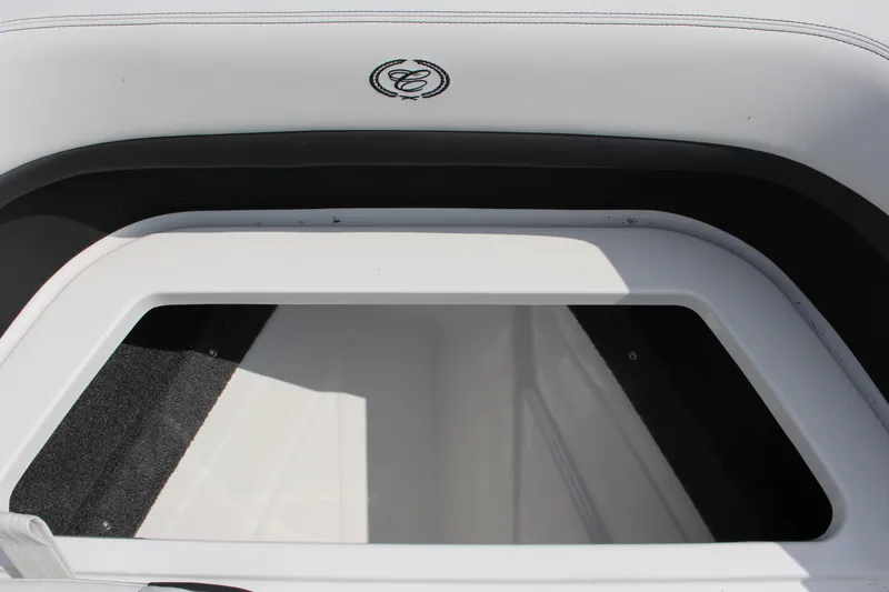 Slide: The Image of 2025 Cobalt R8 boat storage compartment with sleek white interior design. - 18