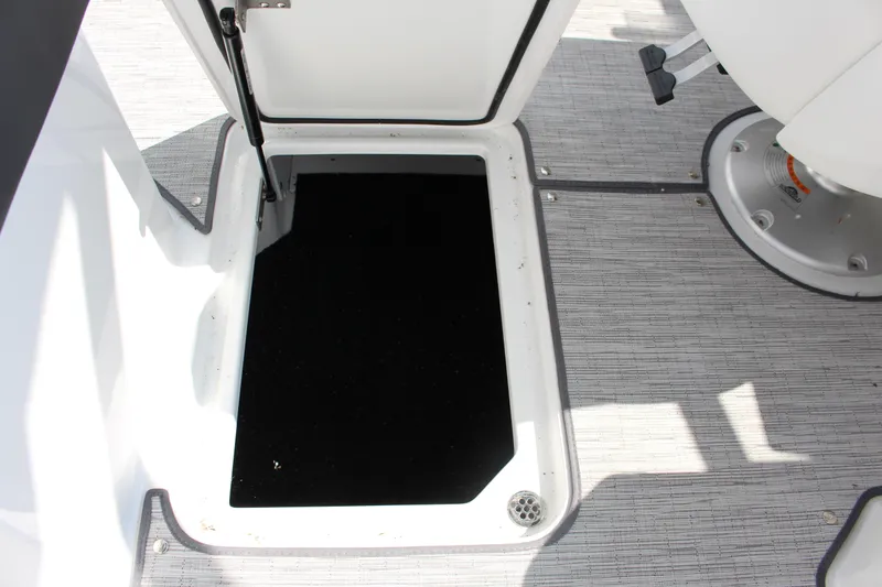 Slide: The Image of Open storage compartment on 2025 Cobalt R8 boat deck. - 21