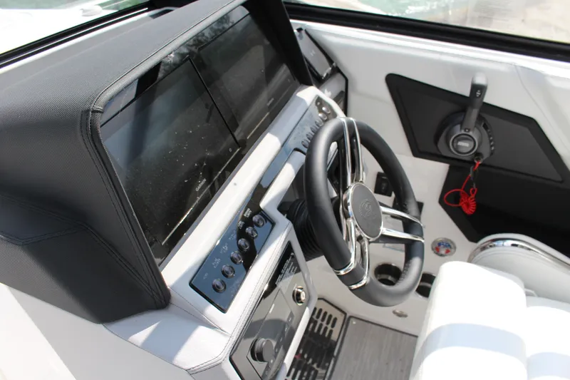 Slide: The Image of 2025 Cobalt R8 boat dashboard with steering wheel and control panel. - 23