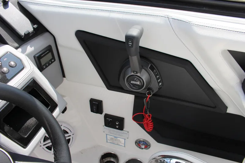 Slide: The Image of Interior of 2025 Cobalt R8 boat with control panel and throttle lever. - 24