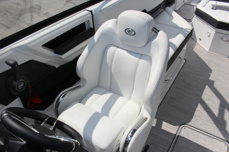 Slide: The Image of Luxurious white interior of 2025 Cobalt R8 boat with sleek seating and controls. - 25