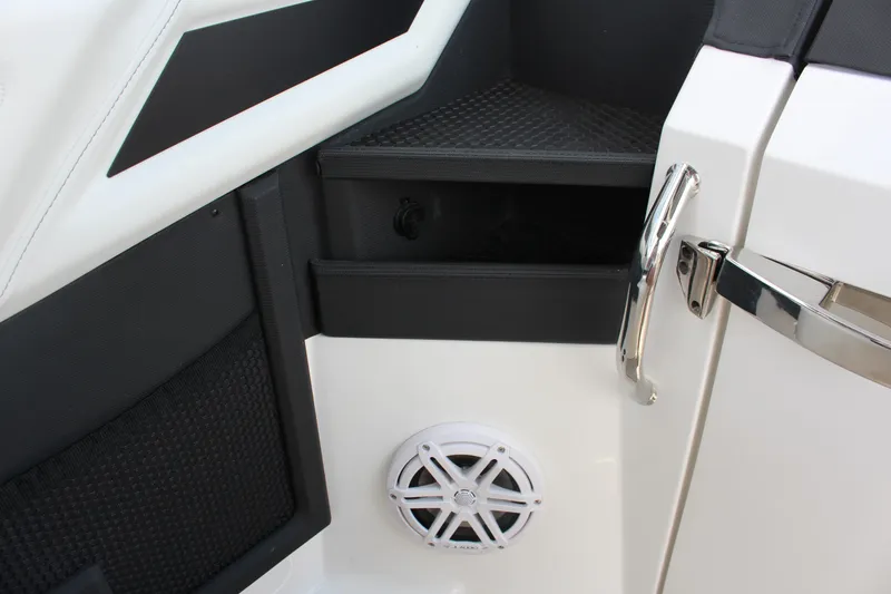 Slide: The Image of 2025 Cobalt R8 interior detail with storage compartment and speaker. - 28
